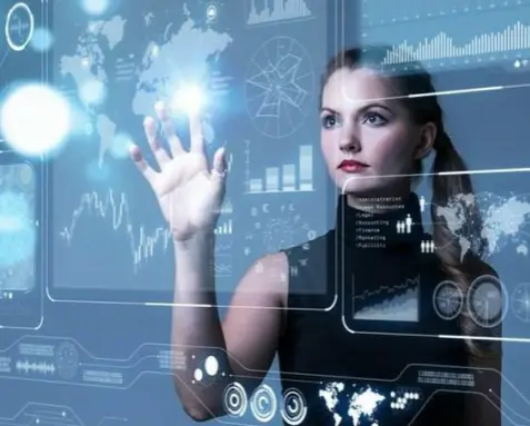 Woman interacting with holographic interface displaying integration patterns and architectures, symbolizing MuleSoft developers' proficiency in designing and developing integration solutions using various middleware technologies.