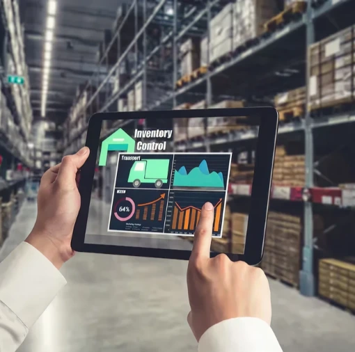 Person using tablet with inventory control dashboard in a warehouse, representing enterprise AI solutions that enhance supply chain visibility, optimize inventory, and improve operational efficiency through advanced forecasting models