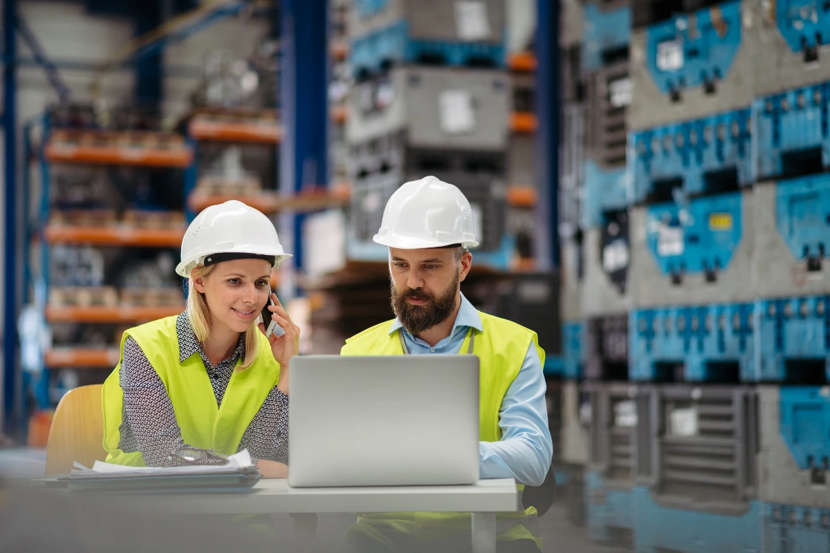 Manufacturing team using white label AI software to manage production workflows, inventory data, and ERP-integrated operations in an industrial facility